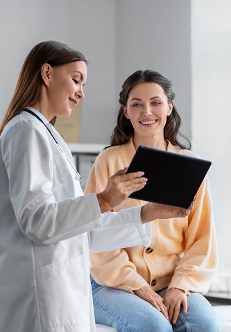 A patient looking over lab results with her doctor